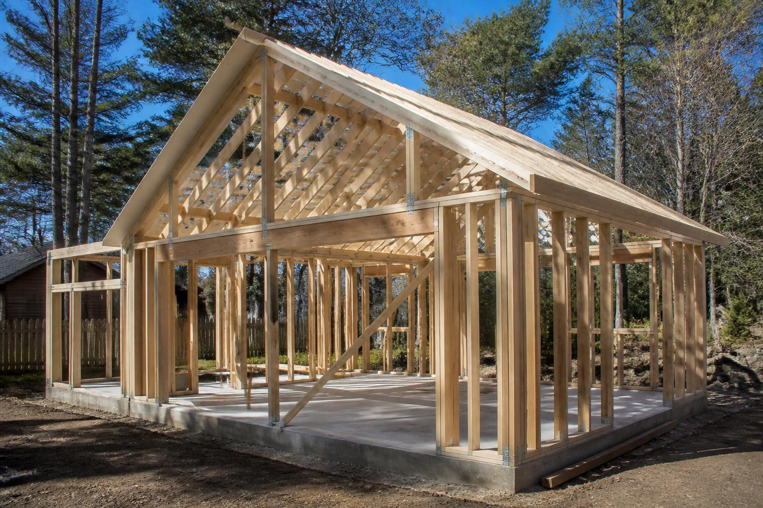 Framing going up with tall ceiling structure visible